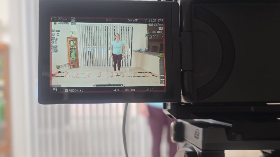 Filming an agility ladder and free weight workout for Fitmotivation.