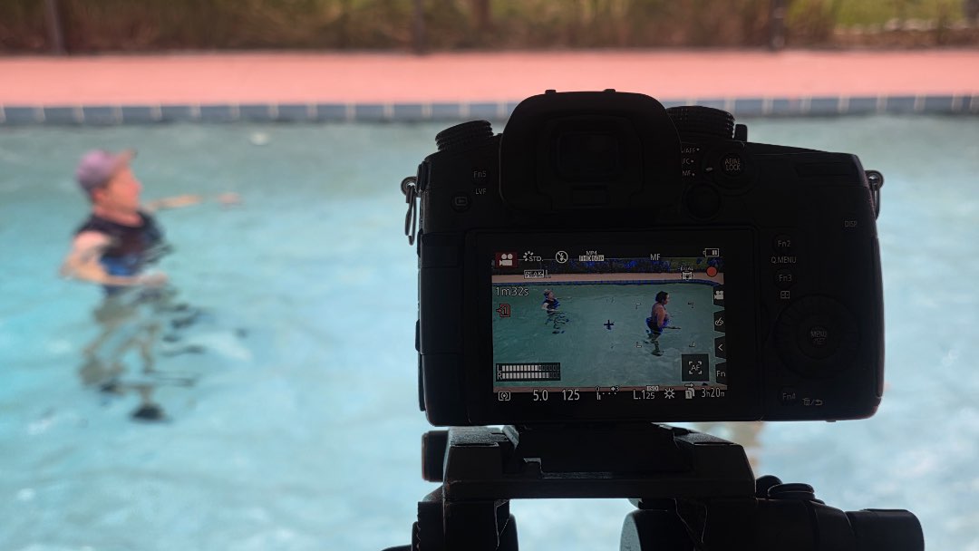 Filming Depth Charge, a cardio strength workout for the Poolfit app.